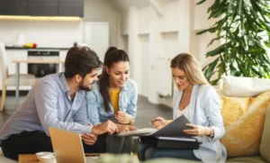 Realtor going over information with some clients.